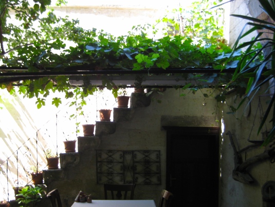 in the courtyard of the old Greek house