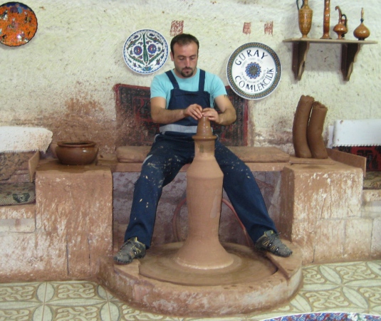 a potter at the pottery factory